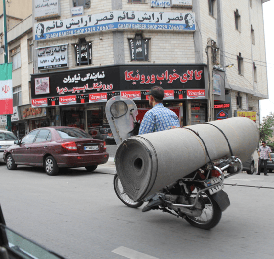 Delivering carpet, Iran