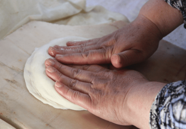 kneading Uzbek bread