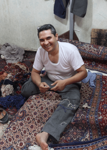 Repairing carpet, Iran