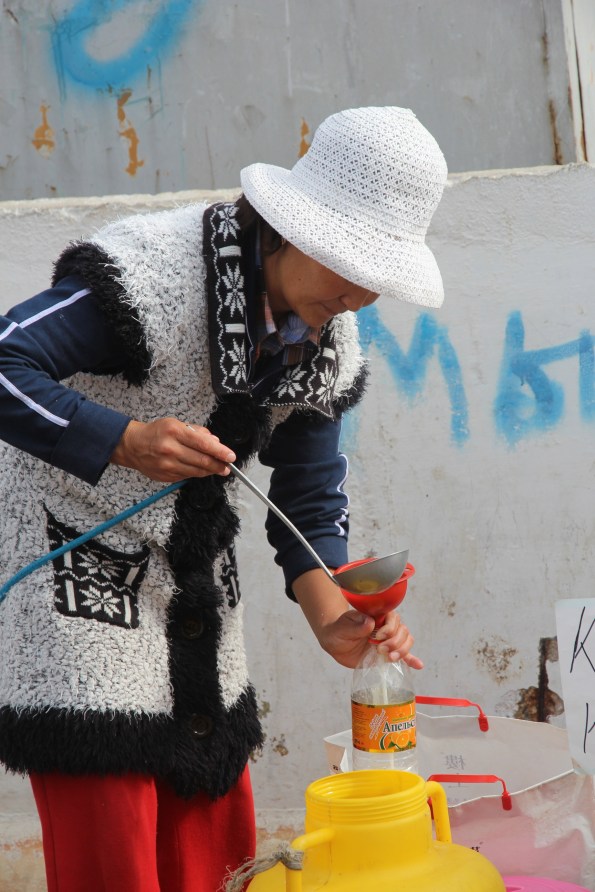 Ladling up mare's milk