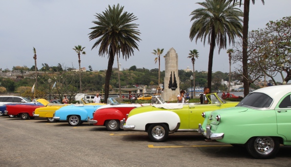 Vintage cars in Cuba waiting for passengers