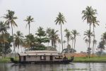 Kerala houseboat with&nbsp;palms