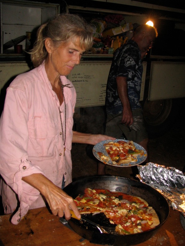 Serving pizza