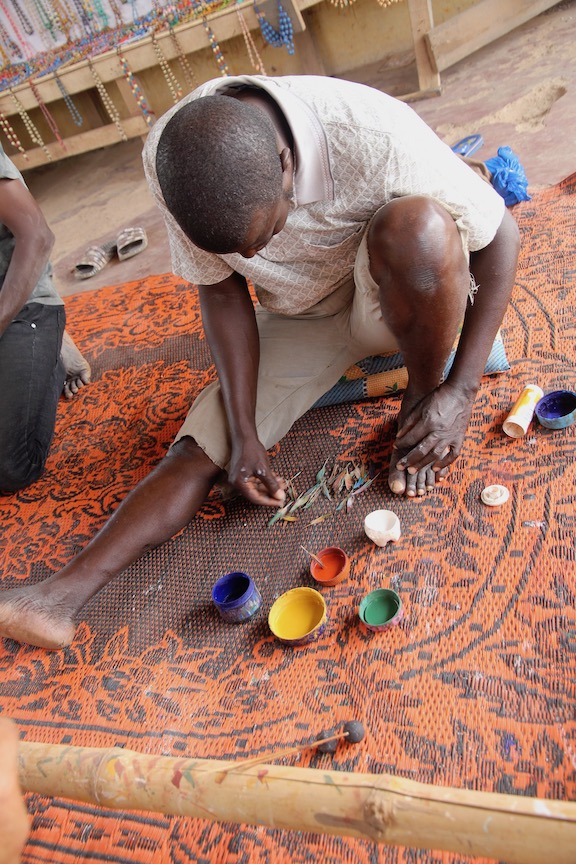 Decorating a bead in the Ivory Coast