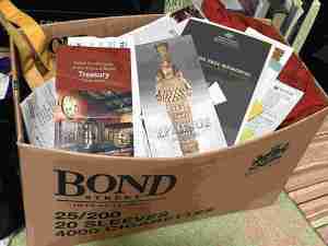 box of travel brochures